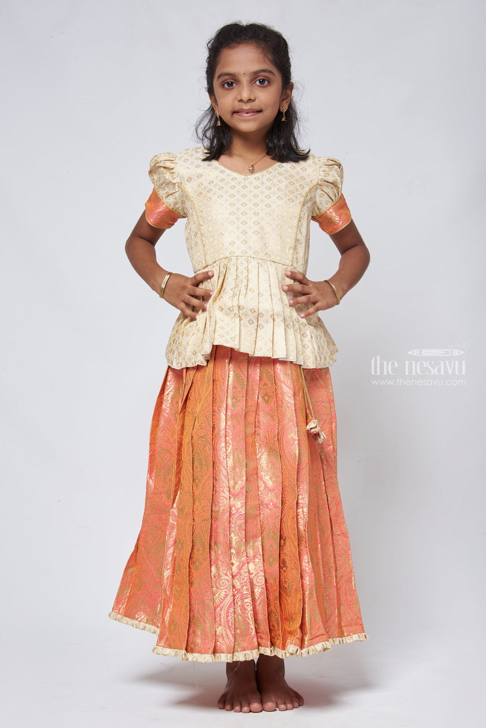 The Nesavu Pattu Pavadai Classy Brocade Beige Peplum Top with Banarasi Salmon Pattu Langa: Authentic Silk Ensemble Nesavu Banarasi Designer Pattu Langa | Girls traditional silk dresses | The Nesavu