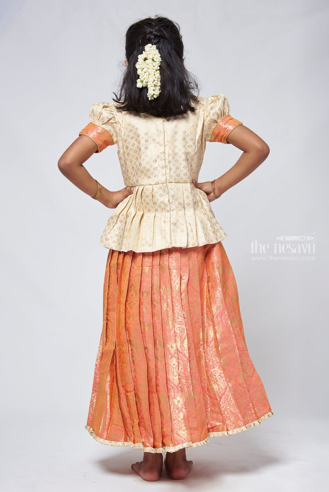 The Nesavu Pattu Pavadai Classy Brocade Beige Peplum Top with Banarasi Salmon Pattu Langa: Authentic Silk Ensemble Nesavu Banarasi Designer Pattu Langa | Girls traditional silk dresses | The Nesavu