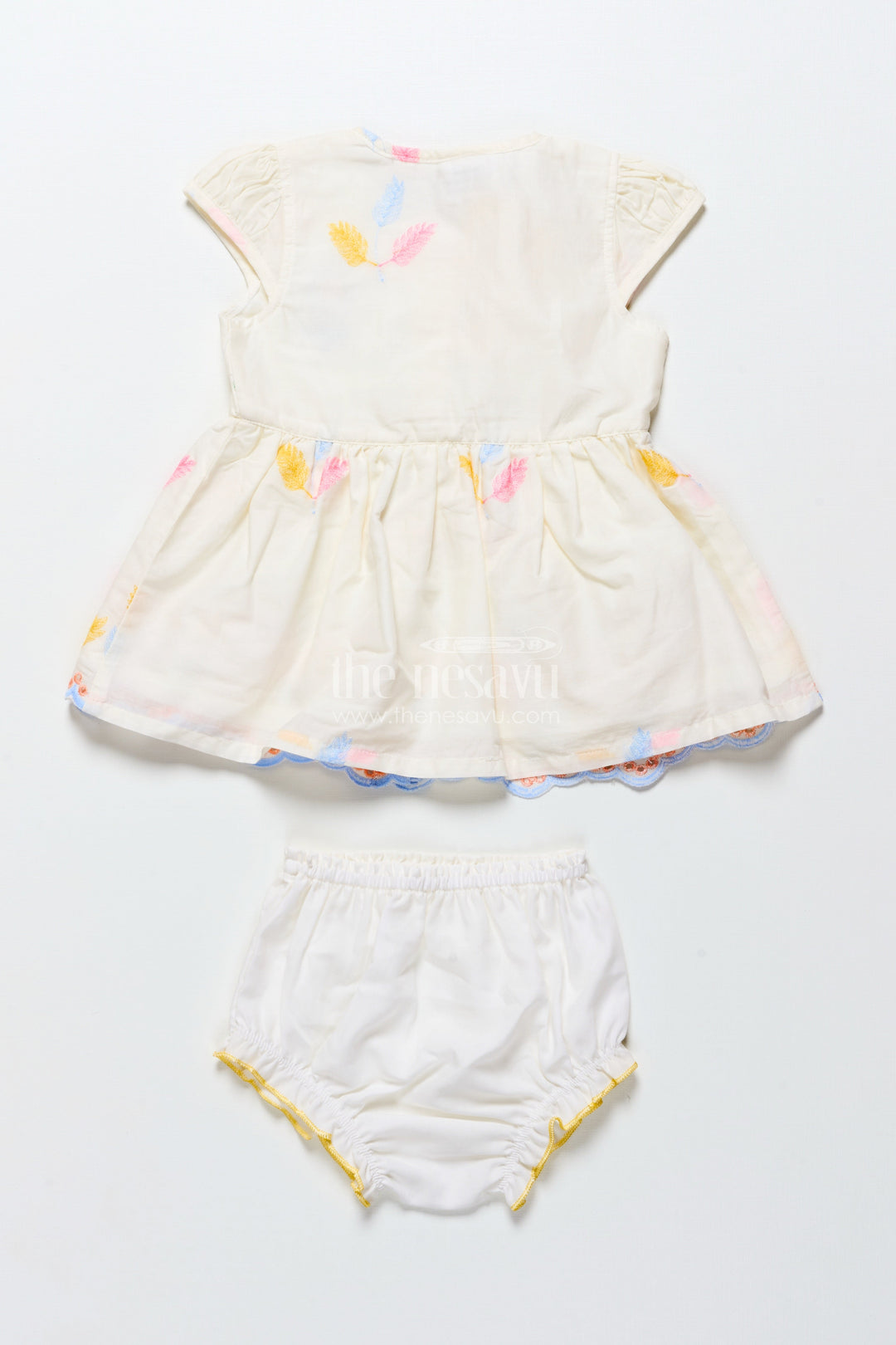 The Nesavu Baby Frocks Cream Baby Frock with Pastel Thread Embroidery and Flower Patch Nesavu Nesavu cream cotton baby frock with pastel embroidery and flower patch