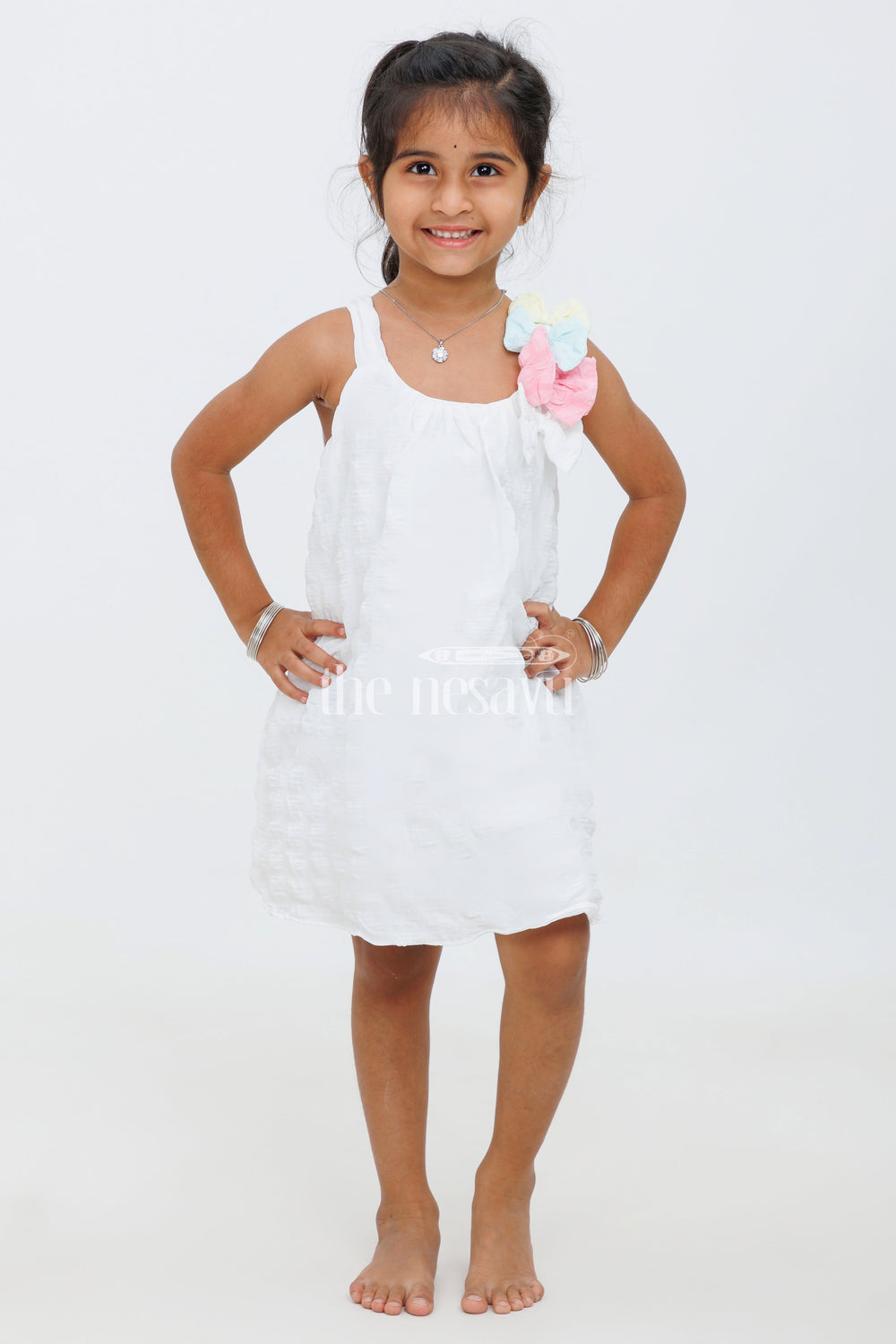 The Nesavu Baby Fancy Frock Cream Baby Frock with Popcorn Fabric and Colorful Bow Accent for Girls Nesavu Cream Baby Frock with Popcorn Fabric and Colorful Bow Accent for Girls Nesavu