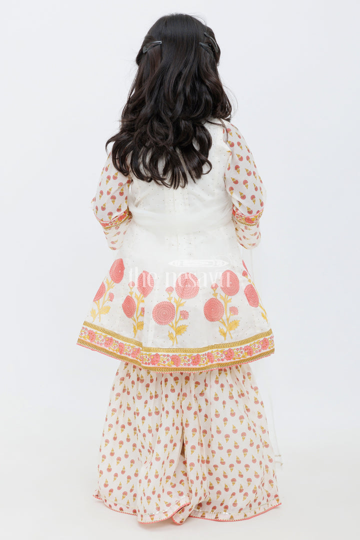 The Nesavu Girls Sharara / Plazo Set Cream Cotton ALine Top with Floral Ghagra Set for Girls with Mirror Work Embellishments Nesavu Cream and Peach Cotton A-Line Top and Floral Ghagra Set for Girls with Mirror Work Nesavu