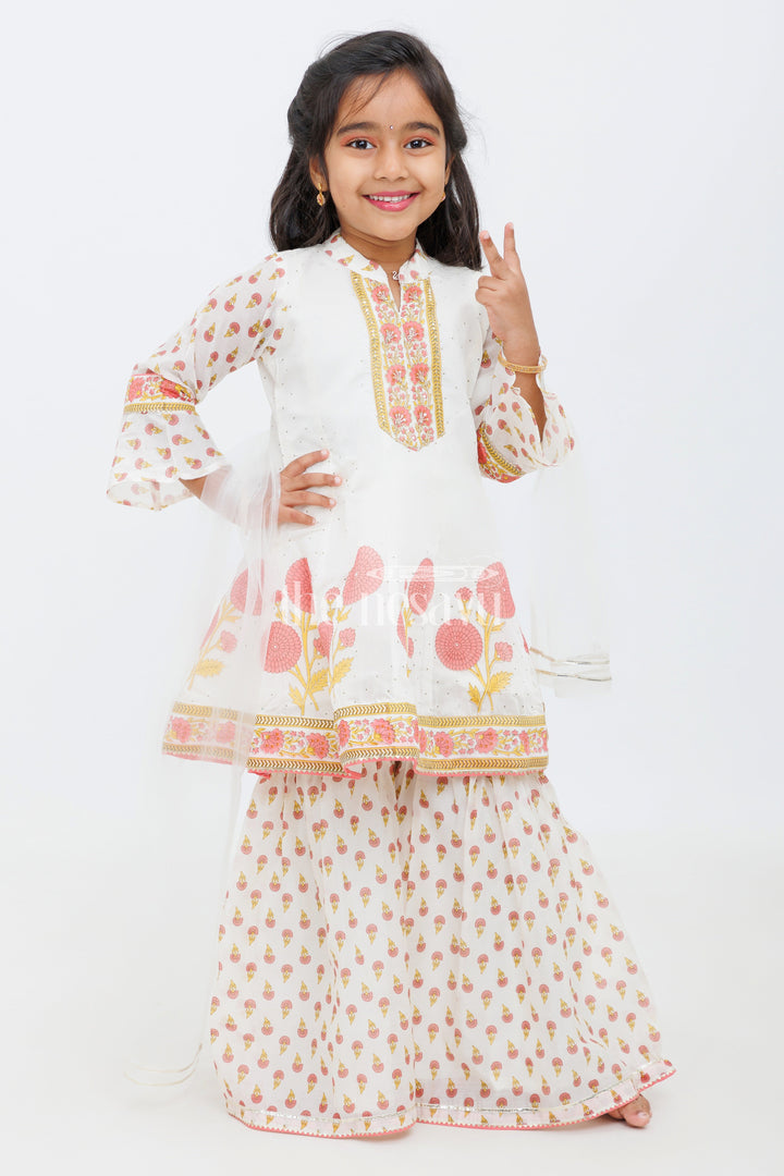 The Nesavu Girls Sharara / Plazo Set Cream Cotton ALine Top with Floral Ghagra Set for Girls with Mirror Work Embellishments Nesavu Cream and Peach Cotton A-Line Top and Floral Ghagra Set for Girls with Mirror Work Nesavu