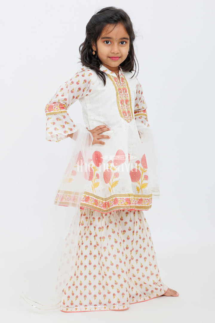 The Nesavu Girls Sharara / Plazo Set Cream Cotton ALine Top with Floral Ghagra Set for Girls with Mirror Work Embellishments Nesavu Cream and Peach Cotton A-Line Top and Floral Ghagra Set for Girls with Mirror Work Nesavu