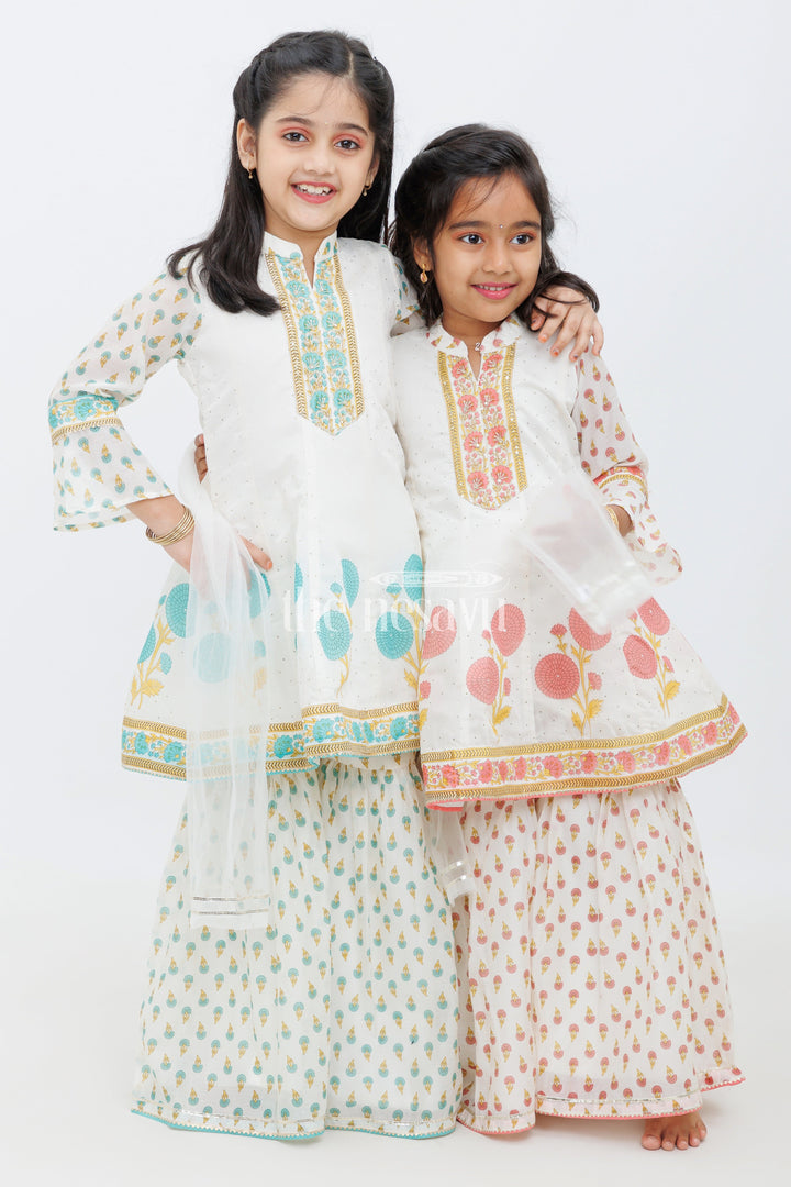 The Nesavu Girls Sharara / Plazo Set Cream Cotton ALine Top with Floral Ghagra Set for Girls with Mirror Work Embellishments Nesavu Cream Cotton A-Line Top and Floral Ghagra Set for Girls with Mirror Work Nesavu
