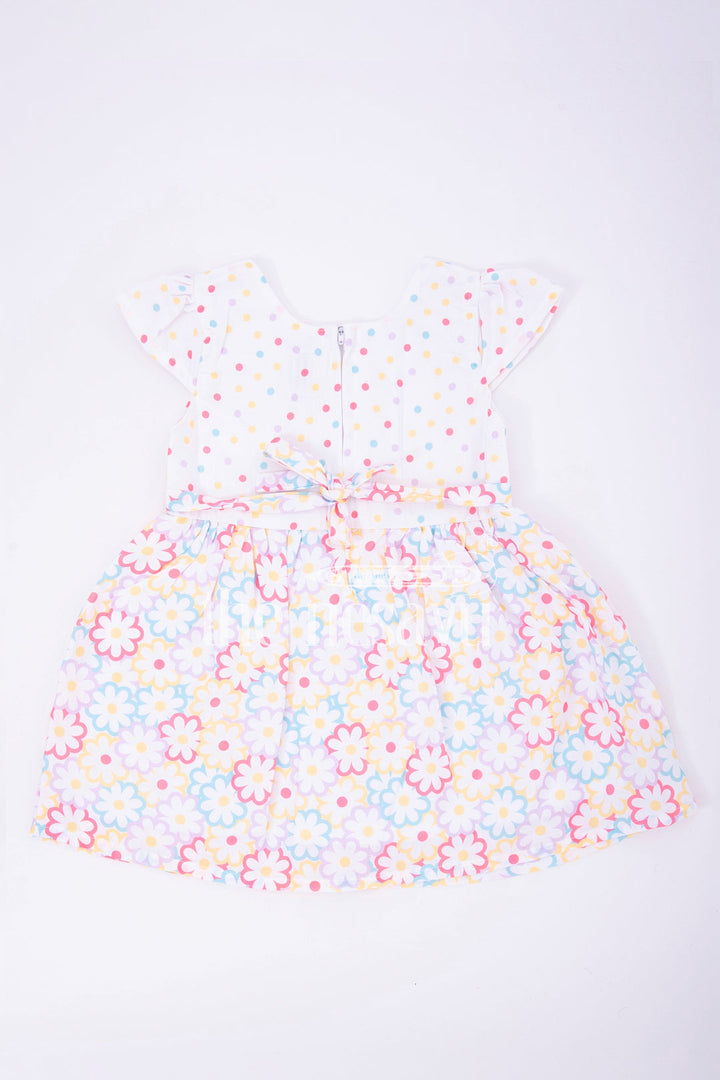 The Nesavu Baby Fancy Frock Cream Poly Blend Baby Frock with Multicolor Floral Print Nesavu Cream Poly Blend Baby Frock with Multicolor Floral Print - Nesavu