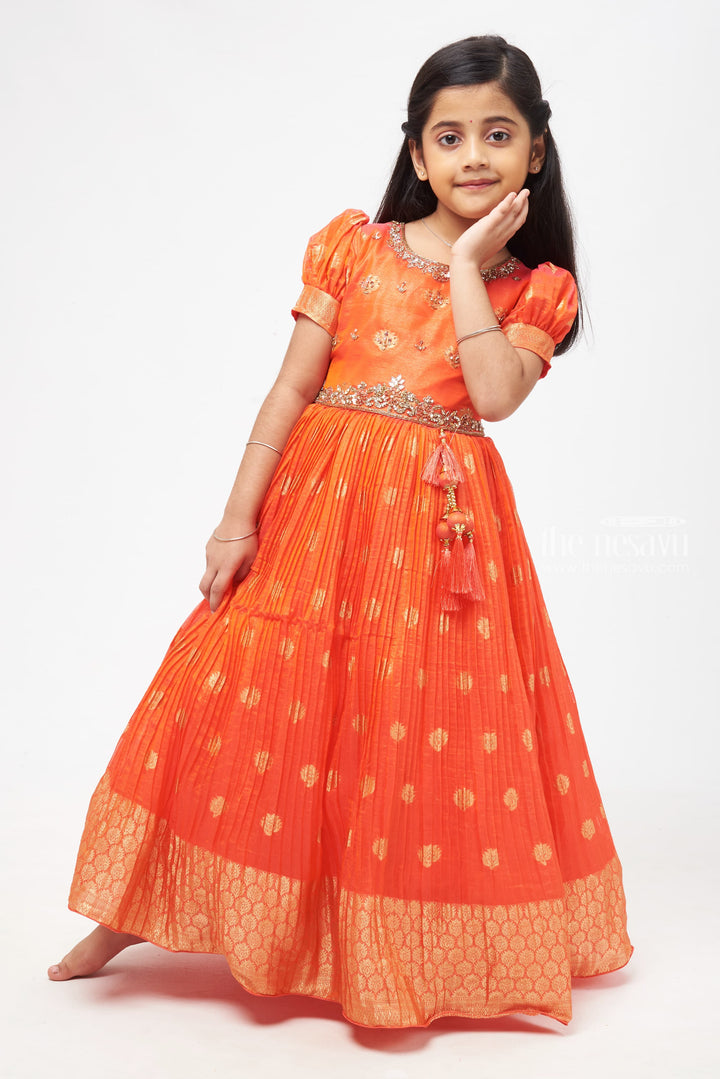 The Nesavu Girls Silk Gown Crimson Elegance: Orange Anarkali with Gilded Accents and Tassel Detailing Nesavu Royal Affair: Anarkali Gowns for Timeless Grace | The Nesavu