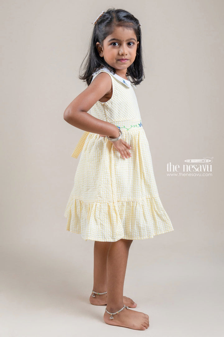 The Nesavu Girls Cotton Frock Cute Peter Pan Collared Chekered Pattern Yellow Girls Frock With Floral Embroidered Nesavu Girls Cotton Frock Online | Casual Wear For Girls | The Nesavu
