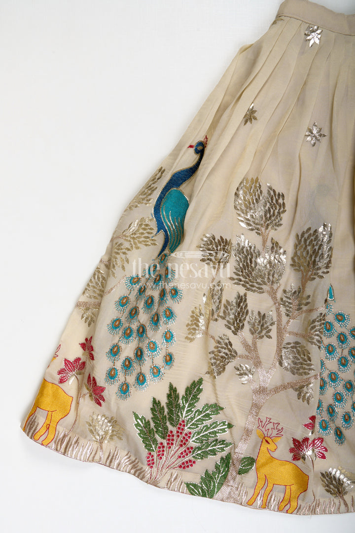 The Nesavu Girls Lehenga Choli Dress Lacha Beige Kora Silk Cotton Girls Lehenga Choli with Peacock and Deer Thread Embroidery Nesavu Nesavu Dress Lacha Girls Beige Kora Silk Cotton Lehenga Choli Peacock Embroidery Dupatta