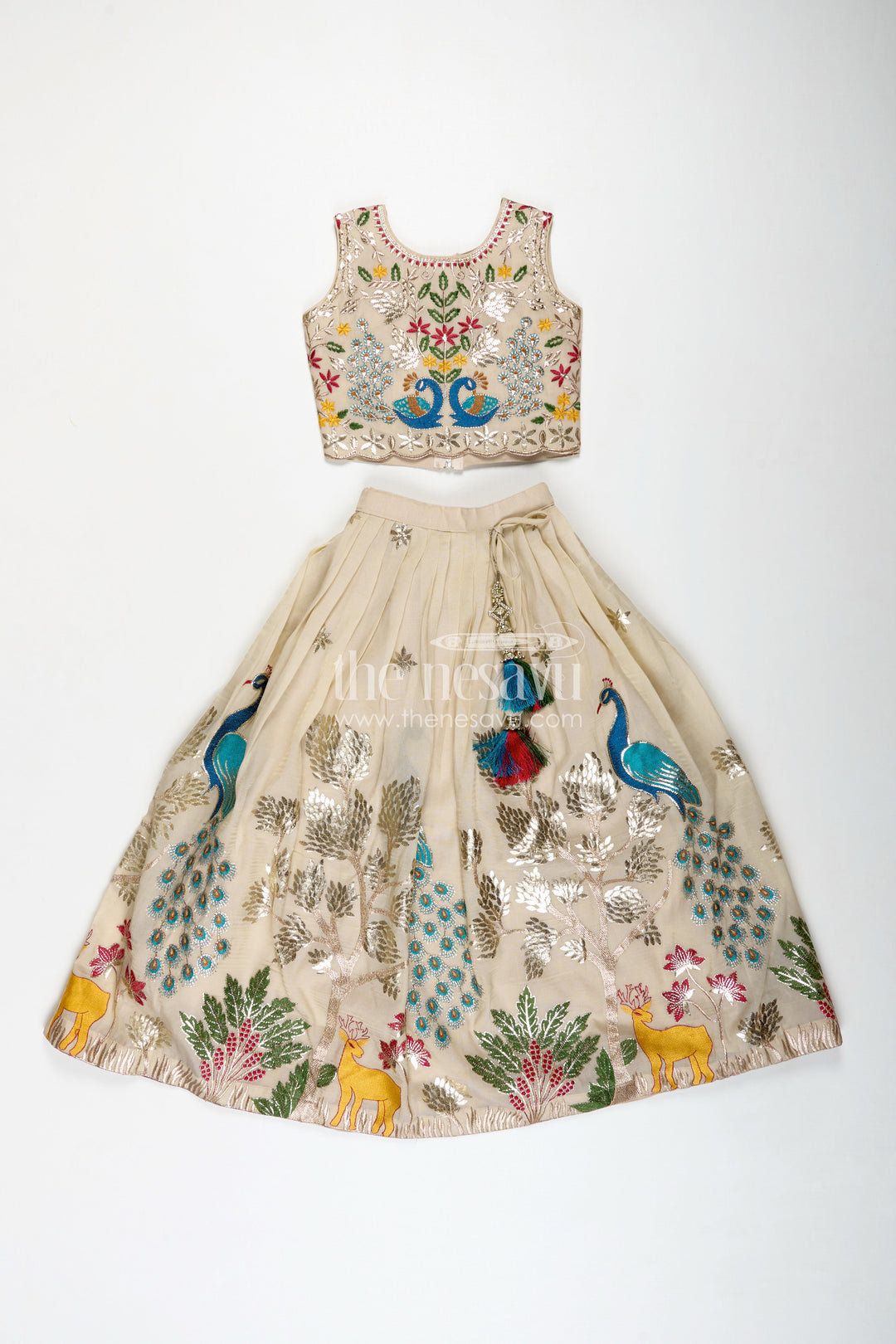The Nesavu Girls Lehenga Choli Dress Lacha Beige Kora Silk Cotton Girls Lehenga Choli with Peacock and Deer Thread Embroidery Nesavu Nesavu Dress Lacha Girls Beige Kora Silk Cotton Lehenga Choli Peacock Embroidery Dupatta