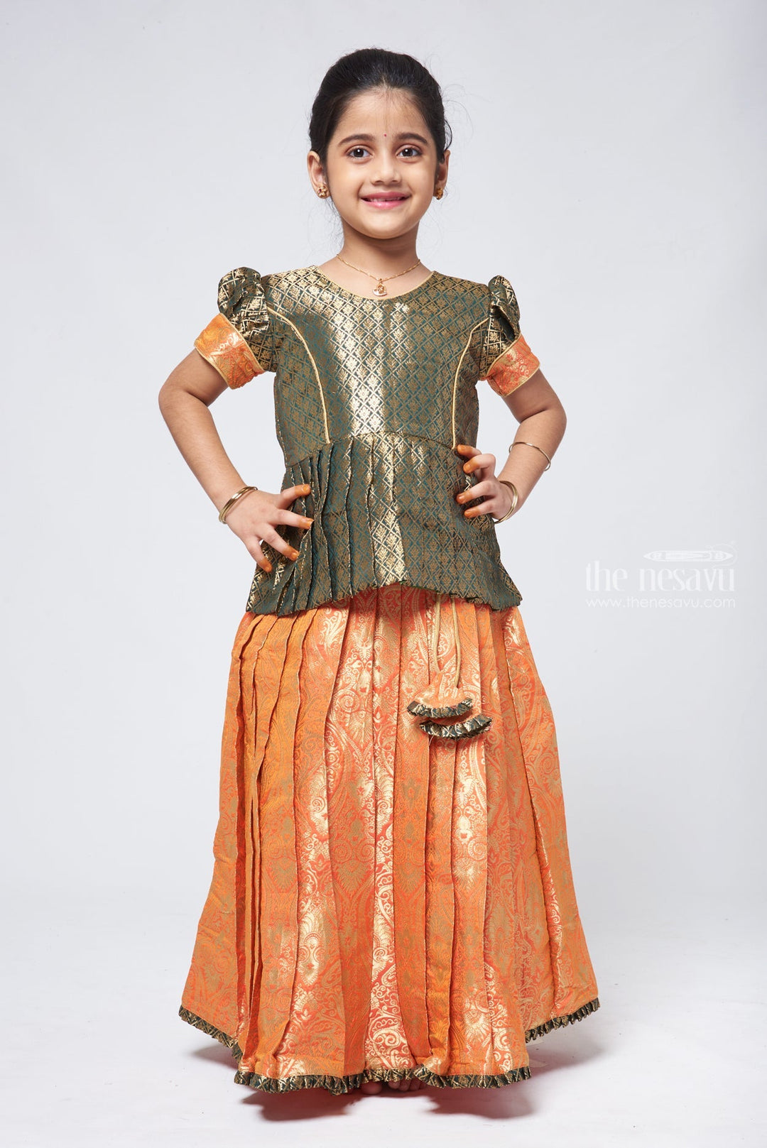 The Nesavu Pattu Pavadai Elegant Brocade Peplum Green Blouse paired with Banarasi Salmon Pink Pattu Pavadai: Timeless South Indian Nesavu 14 (6M) / Salmon GPP292A-14 Elegant Brocade Designer Pattu Pavadai for Girls | Banaras Silk Pattu Pavadai | The Nesavu