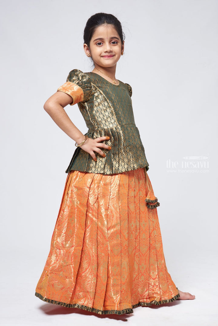 The Nesavu Pattu Pavadai Elegant Brocade Peplum Green Blouse paired with Banarasi Salmon Pink Pattu Pavadai: Timeless South Indian Nesavu Elegant Brocade Designer Pattu Pavadai for Girls | Banaras Silk Pattu Pavadai | The Nesavu