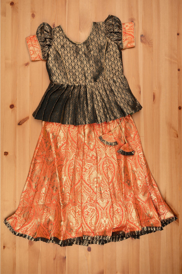 The Nesavu Pattu Pavadai Elegant Brocade Peplum Green Blouse paired with Banarasi Salmon Pink Pattu Pavadai: Timeless South Indian Nesavu Elegant Brocade Designer Pattu Pavadai for Girls | Banaras Silk Pattu Pavadai | The Nesavu