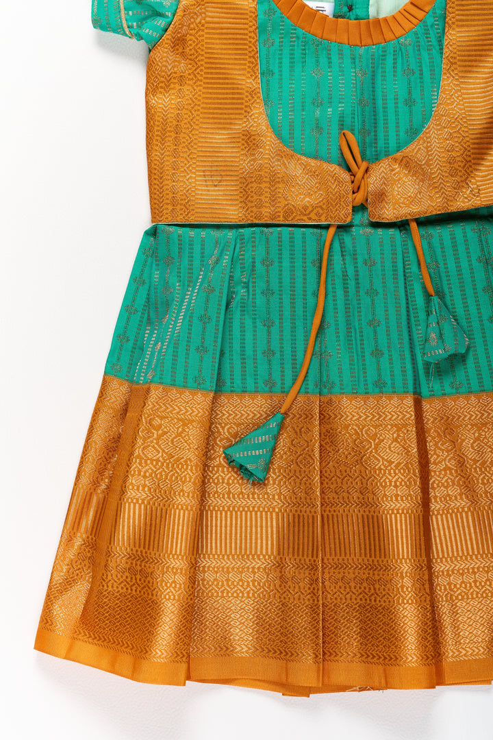 The Nesavu Girls Kanchi Silk Frock Elegant Green and Gold Pattu Full Frock for Girls with Traditional Zari Weaving Nesavu Nesavu Elegant Green Gold Pattu Full Frock Girls Traditional Zari Weaving