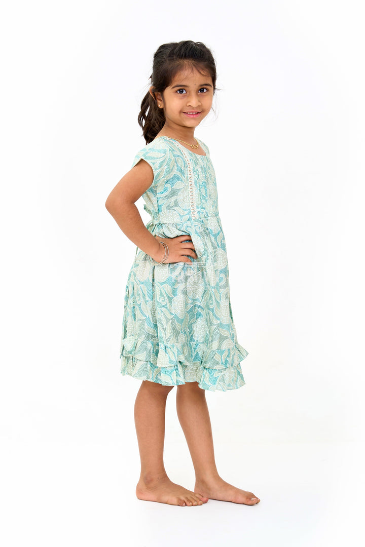 The Nesavu Girls Cotton Frock Elegant Green Cotton Designer Frock for Girls with Floral Prints and Frill Details Nesavu Nesavu Elegant Green Cotton Designer Frock Girls Floral Prints Frill Details