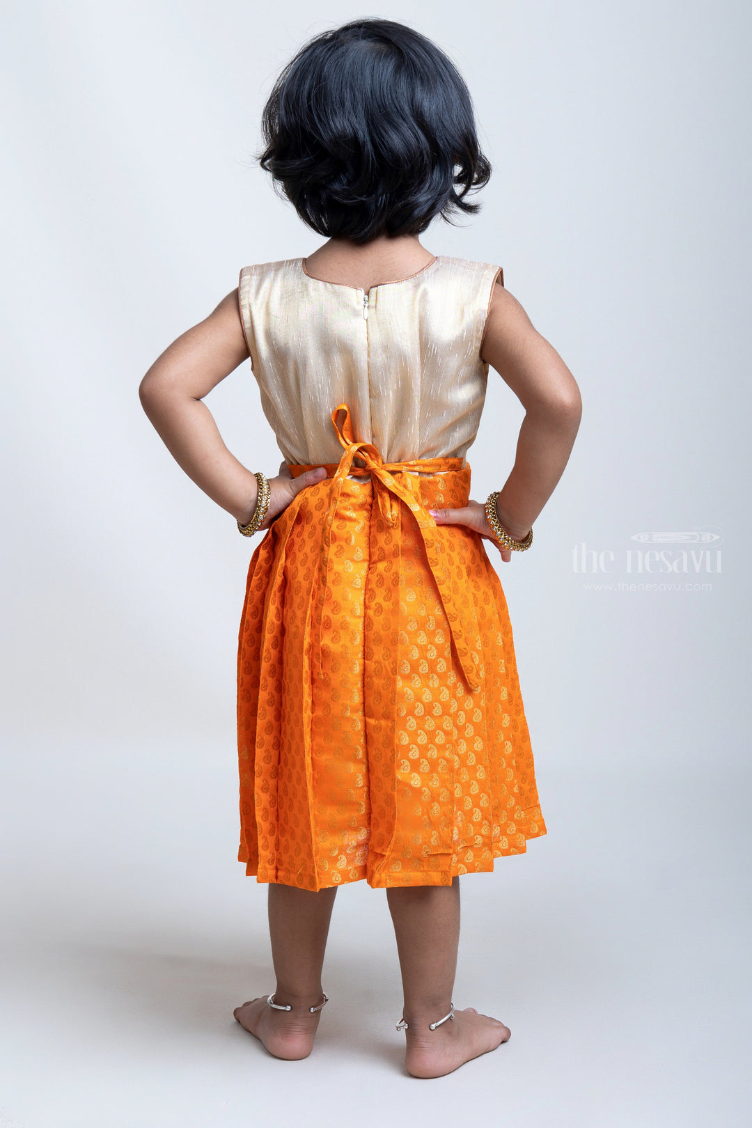 The Nesavu Silk Frock Elegant Orange Pleated Semi-Silk with Beige Pleated Yoke Frock For Girls Nesavu Premium Quality Silk Frocks | New Silk Frock Collections | The Nesavu