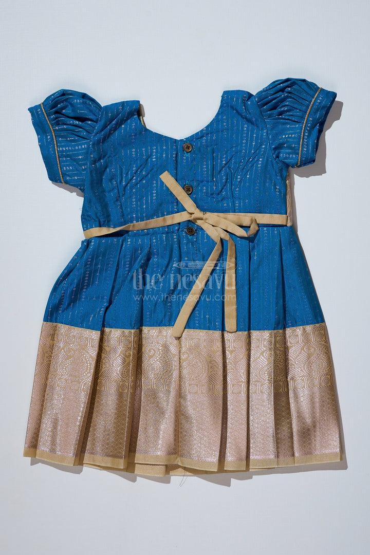 The Nesavu Girls Kanchi Silk Frock Elegant Teal Silk Dress for Girls with Kanchipuram Inspired Fabric and Gold Zari Pleated Border Nesavu Nesavu Teal Silk Dress Girls Kanchipuram Inspired Fabric Gold Zari Pleated Border