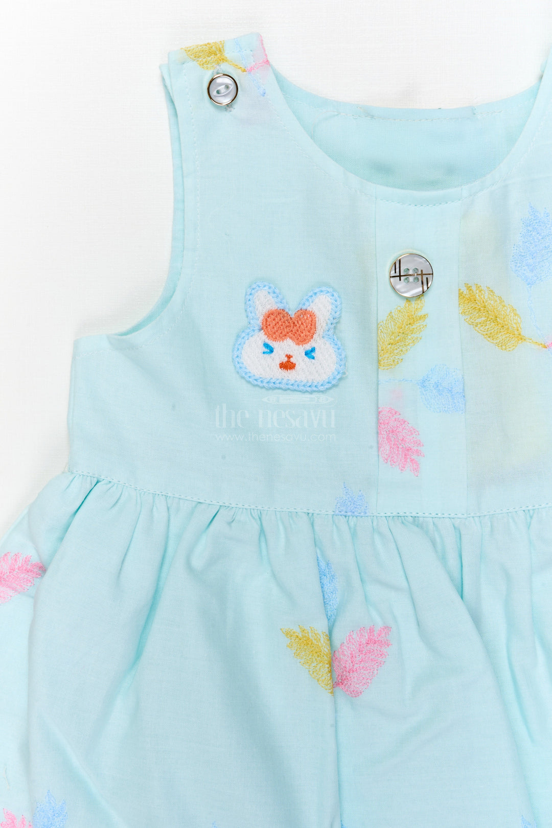 The Nesavu Baby Cotton Frocks Embroidered Baby Frock and Bloomer Set with Playful Leaf Detailing Nesavu Baby frock and bloomer set with multicolor leaf embroidery and character motif