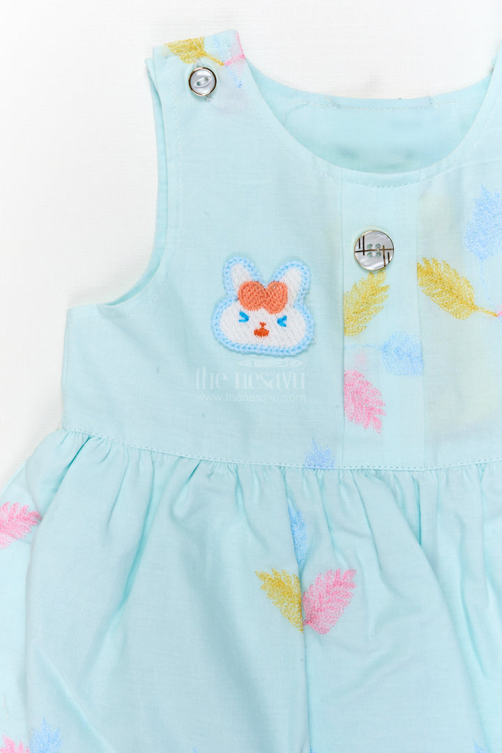 The Nesavu Baby Cotton Frocks Embroidered Baby Frock and Bloomer Set with Playful Leaf Detailing Nesavu Baby frock and bloomer set with multicolor leaf embroidery and character motif