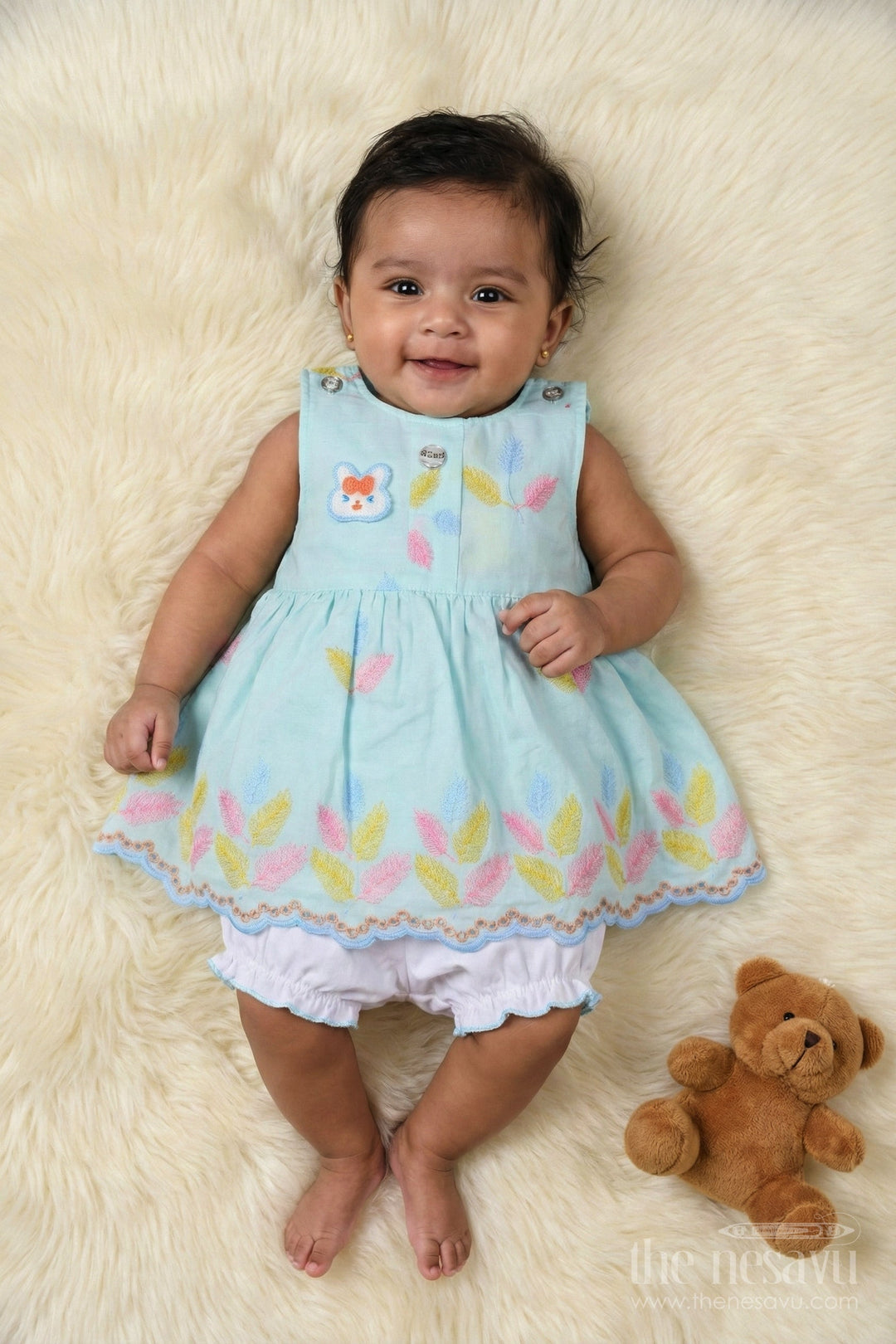 Baby frock and bloomer set with multicolor leaf embroidery and character motif The Nesavu Baby frock and bloomer set with multicolor leaf embroidery and character motif The Nesavu