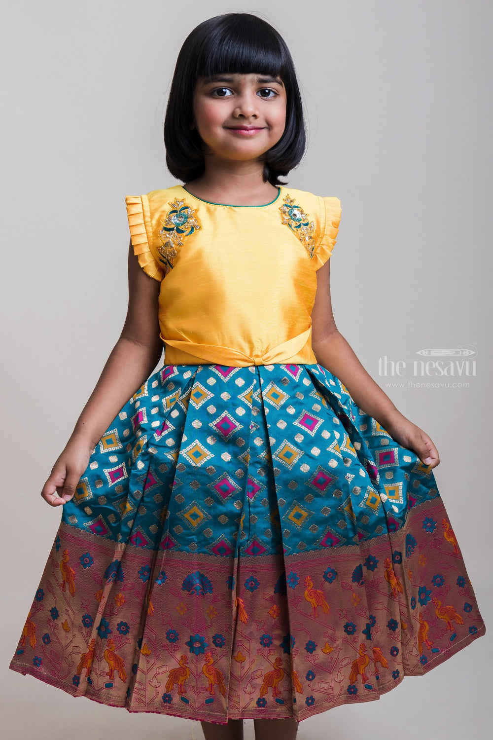The Nesavu Silk Party Frock Embroidered Yellow Yoke And Copper-Toned Zari Border Silk Frocks For Girls Nesavu Ruffled Sleeves Silk Frock Collection| Pongal Special Arrival| The Nesavu