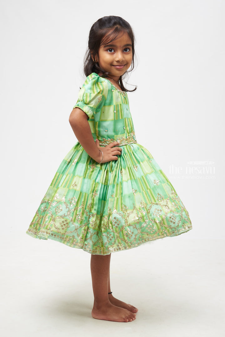 The Nesavu Silk Party Frock Emerald Radiance Girls Dress with Golden Embellishments - Designer Silk Frocks for Festives Nesavu Premium Pattu Gowns | Best Silk Frocks for Diwali Online | The Nesavu