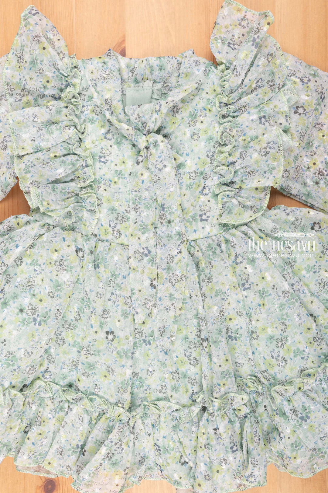 The Nesavu Girls Fancy Frock Enchanting Green Blossoms Crepe Flared N Pleated Frock with Tie Neck for Girls Nesavu Blossoming Beauty: Green Frock for Girls in Delicate Crepe | # Year Girls Frock | the Nesavu