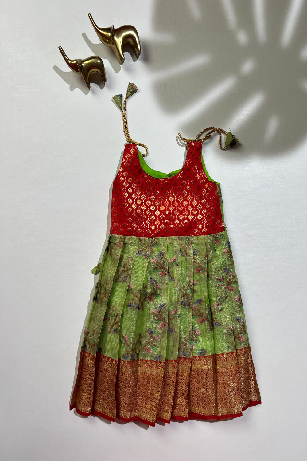 The Nesavu Tie-up Frock Enchanting Green & Red Tie-Up Silk Frock for Girls Nesavu Girls Green Silk Frock | Traditional Floral Print | Festive Wear | The Nesavu