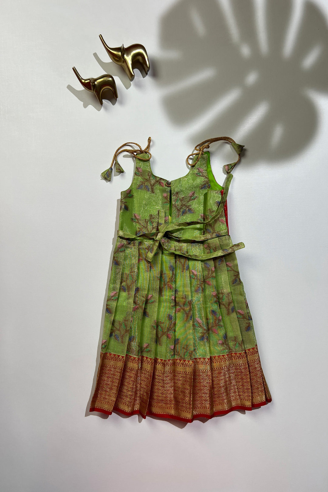The Nesavu Tie-up Frock Enchanting Green & Red Tie-Up Silk Frock for Girls Nesavu Girls Green Silk Frock | Traditional Floral Print | Festive Wear | The Nesavu