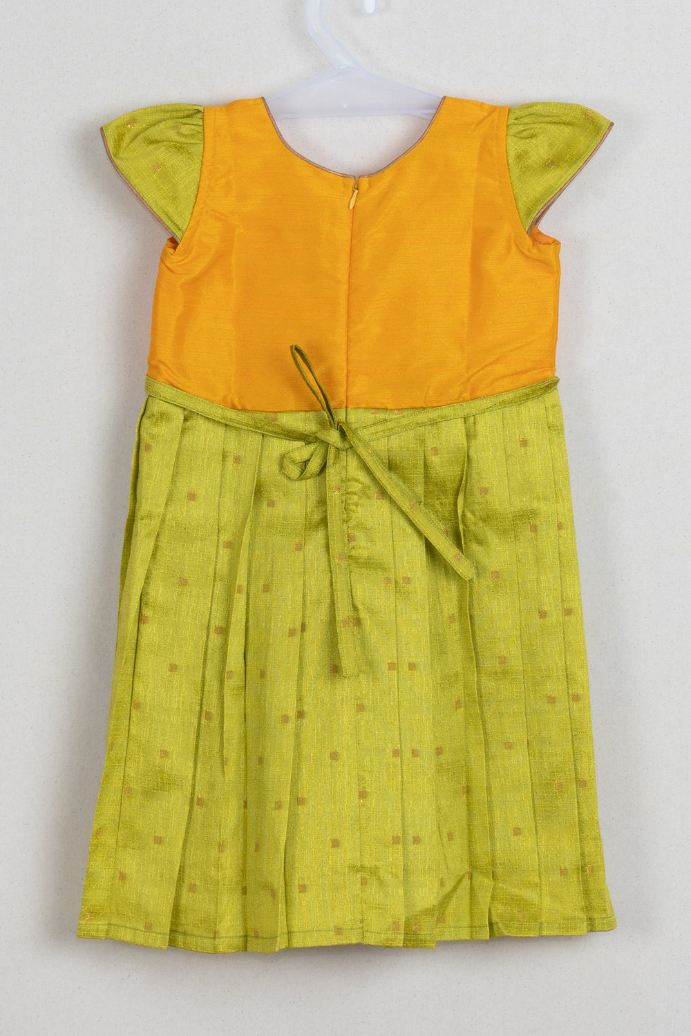 The Nesavu Silk Frock Enchanting Resham Weave Green Silk Attire for Girls with Vibrant Yellow Yoke and Elegant Pleats Nesavu Green Silk Frock For Girls | Traditional Indian wear | The Nesavu