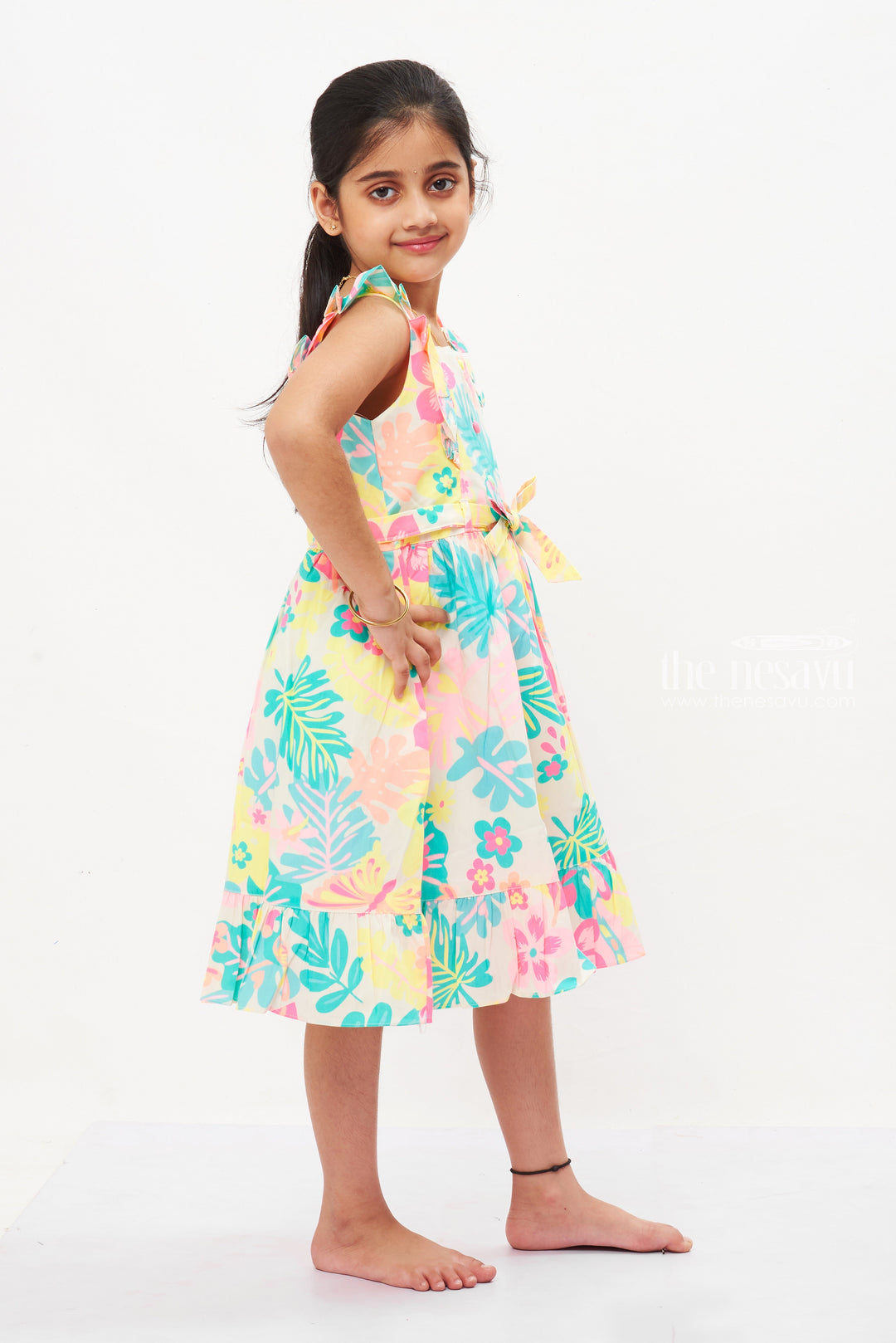 The Nesavu Girls Cotton Frock Exotic Garden Sleeveless Cotton Frock for Girls - Frilled Hem and Vibrant Print Nesavu Girls Floral Cotton Frock | Sleeveless Summer Dress with Frills Online | The Nesavu