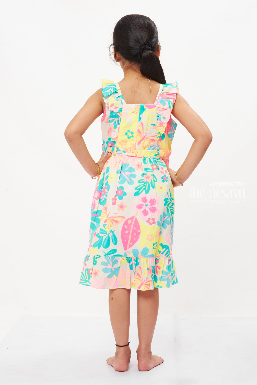 The Nesavu Girls Cotton Frock Exotic Garden Sleeveless Cotton Frock for Girls - Frilled Hem and Vibrant Print Nesavu Girls Floral Cotton Frock | Sleeveless Summer Dress with Frills Online | The Nesavu