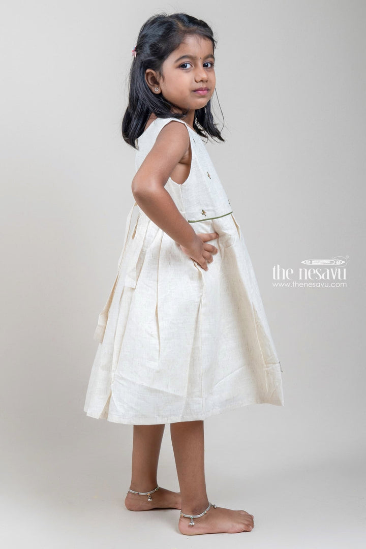 The Nesavu Girls Cotton Frock Floral Embroidered Box Pleated Sleeveless Half White Cotton Frock for Girls Nesavu Floral Embroidered Box Pleated Sleeveless Beige Cotton Frock for Girls | The Nesavu