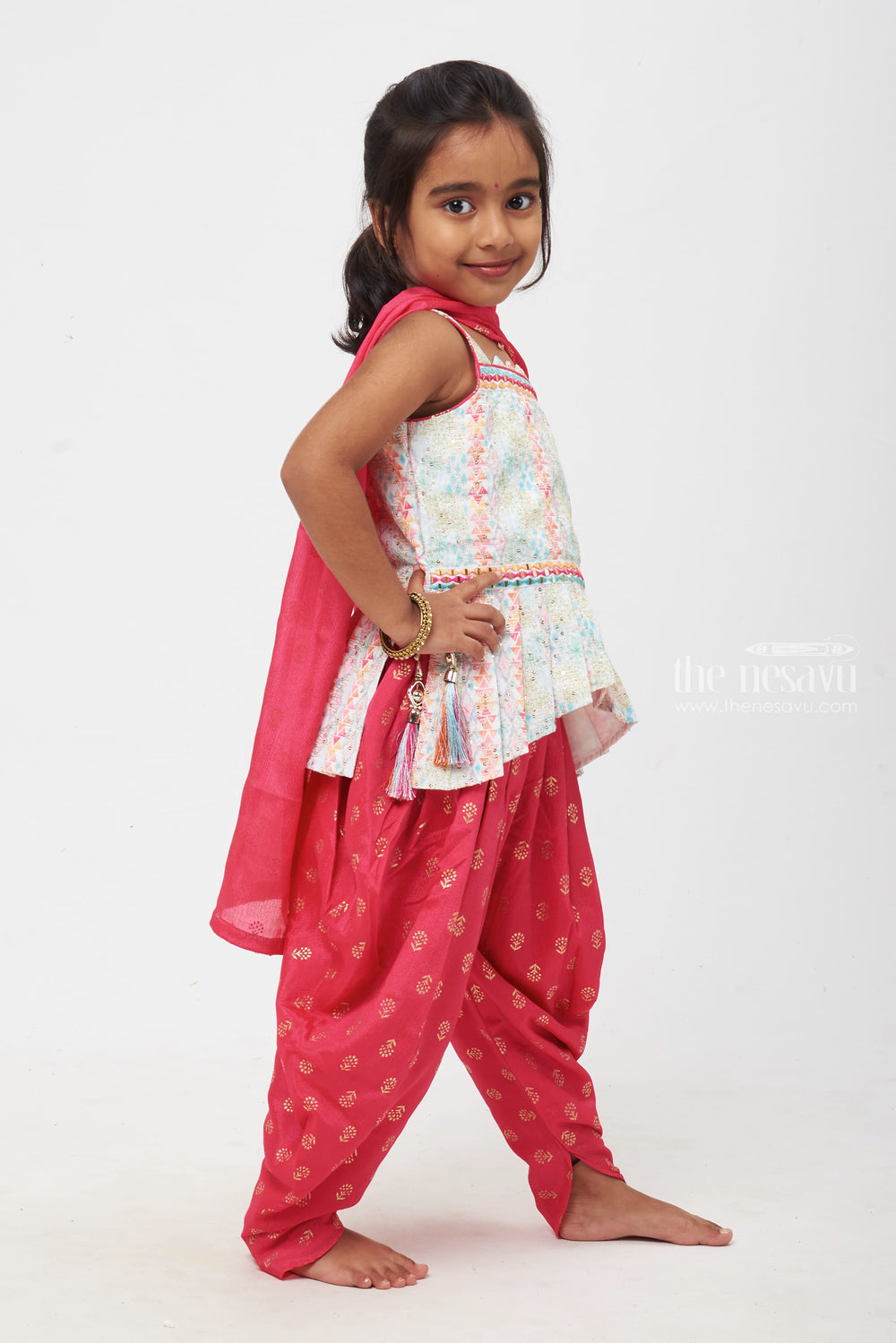 The Nesavu Girls Dothi Sets Floral Fantasy: Girls Pastel Peplum Top with Bold Red Dhoti Nesavu Girls Floral Peplum Top and Red Dhoti Set | Vibrant Kids Festive Wear | The Nesavu