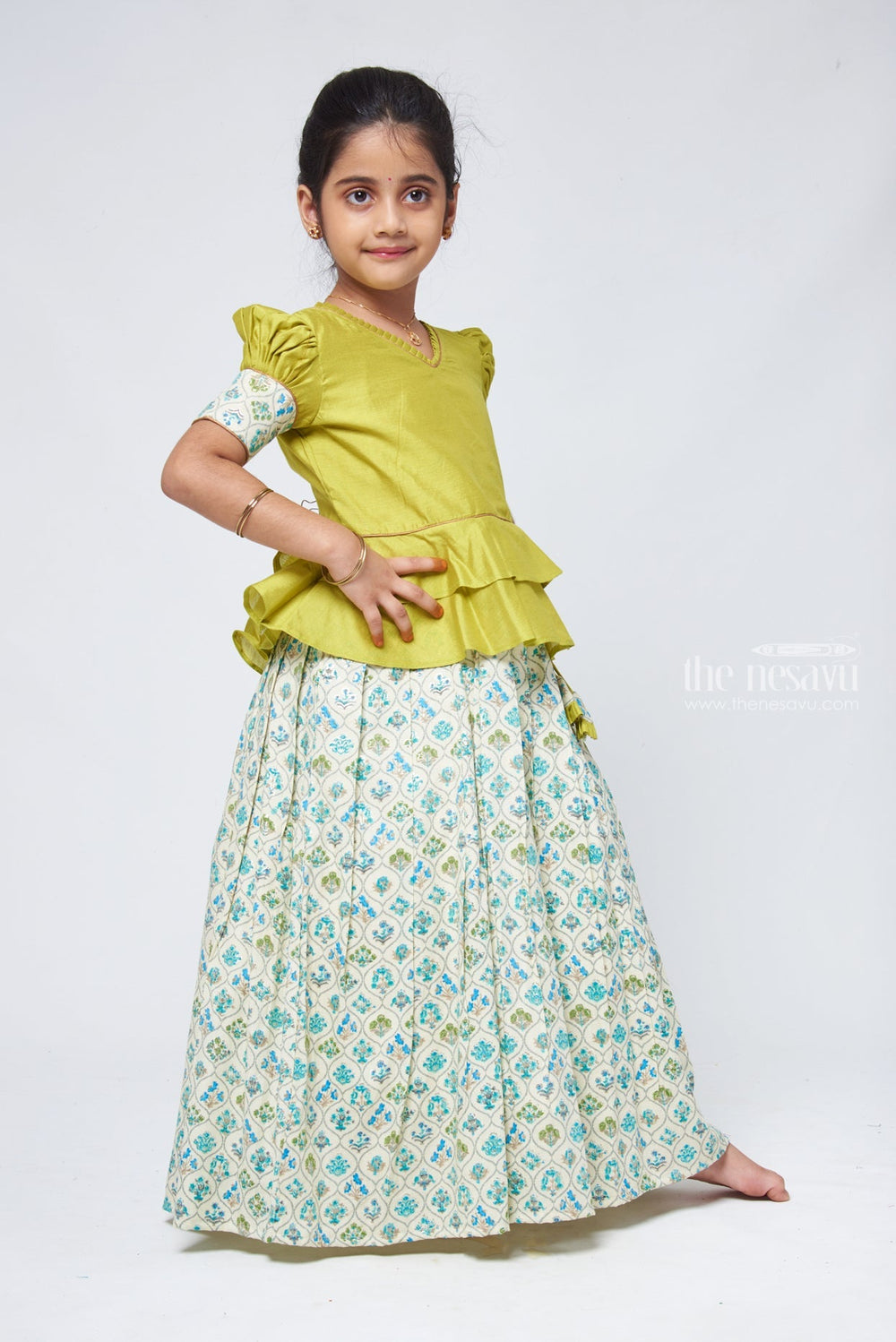 The Nesavu Pattu Pavadai Floral Printed Beige Skirt with Green Jacquard Peplum Blouse Nesavu New Kanchipuram Pattu Pavadai | Silk Dress for Girls | The Nesavu
