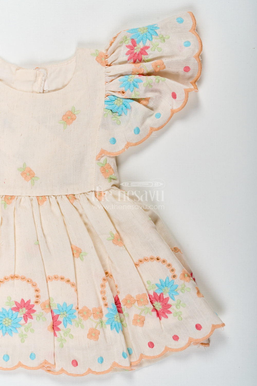The Nesavu Baby Cotton Frocks Frock Baby in Cream Cotton with Multicolor Thread Embroidery and Angel Sleeves Nesavu Nesavu Frock Baby Cream Cotton Multicolor Thread Embroidery Angel Sleeves