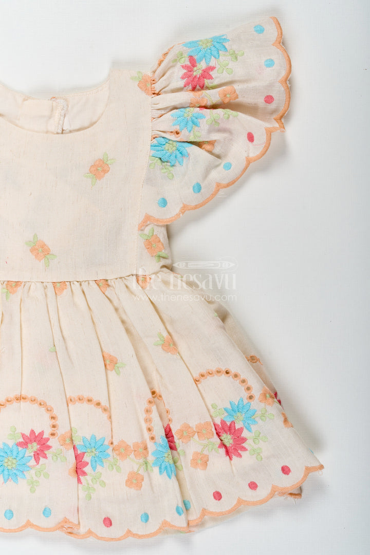 The Nesavu Baby Cotton Frocks Frock Baby in Cream Cotton with Multicolor Thread Embroidery and Angel Sleeves Nesavu Nesavu Frock Baby Cream Cotton Multicolor Thread Embroidery Angel Sleeves