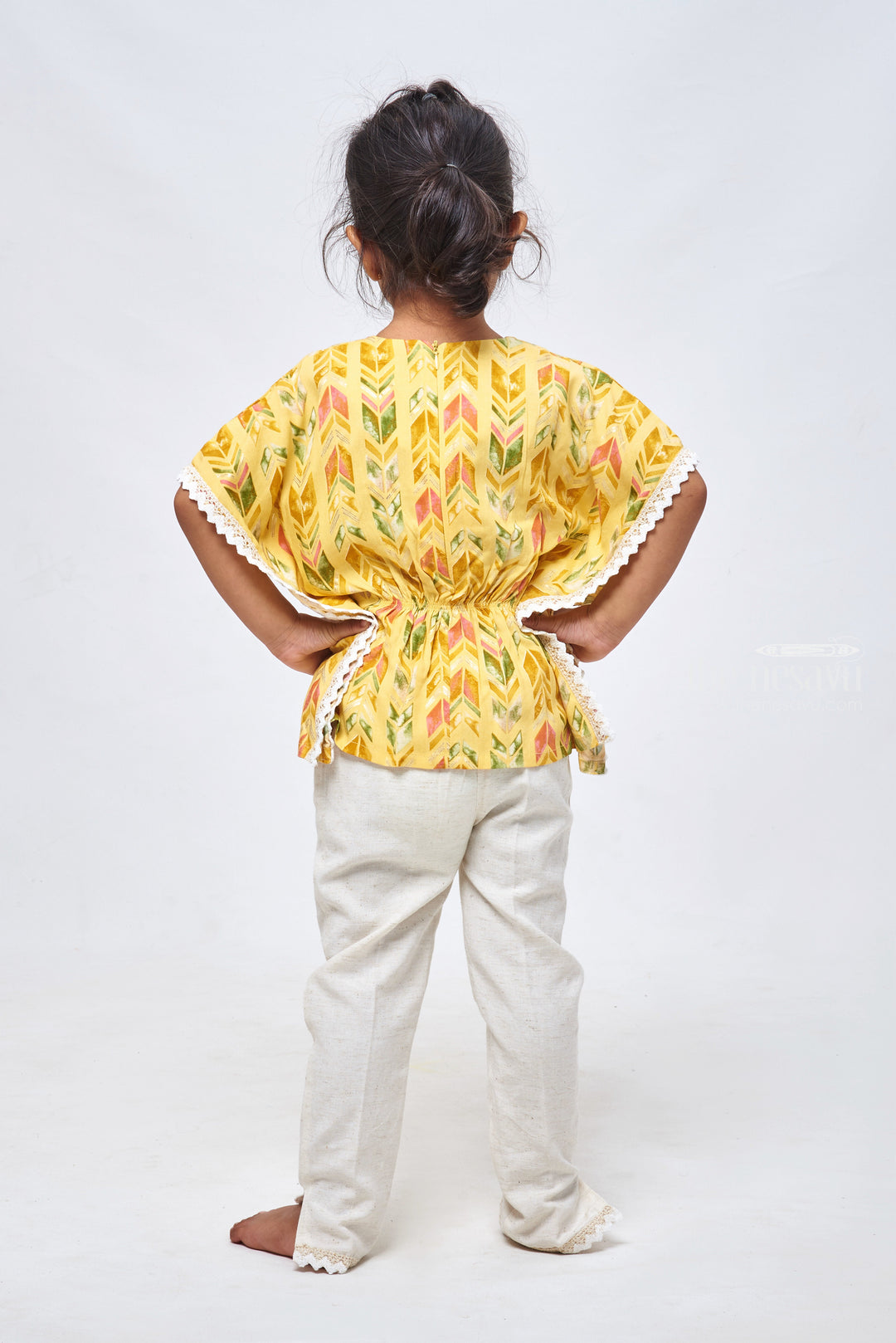 The Nesavu Girls Sharara / Plazo Set Geometrical & Foil Printed Yellow Kaftan Top & Half White Pant: Trendy Fusion for Girls Nesavu Geometric Printed Dreeses for Girls | Kaftan Top With Straight Pant | the Nesavu