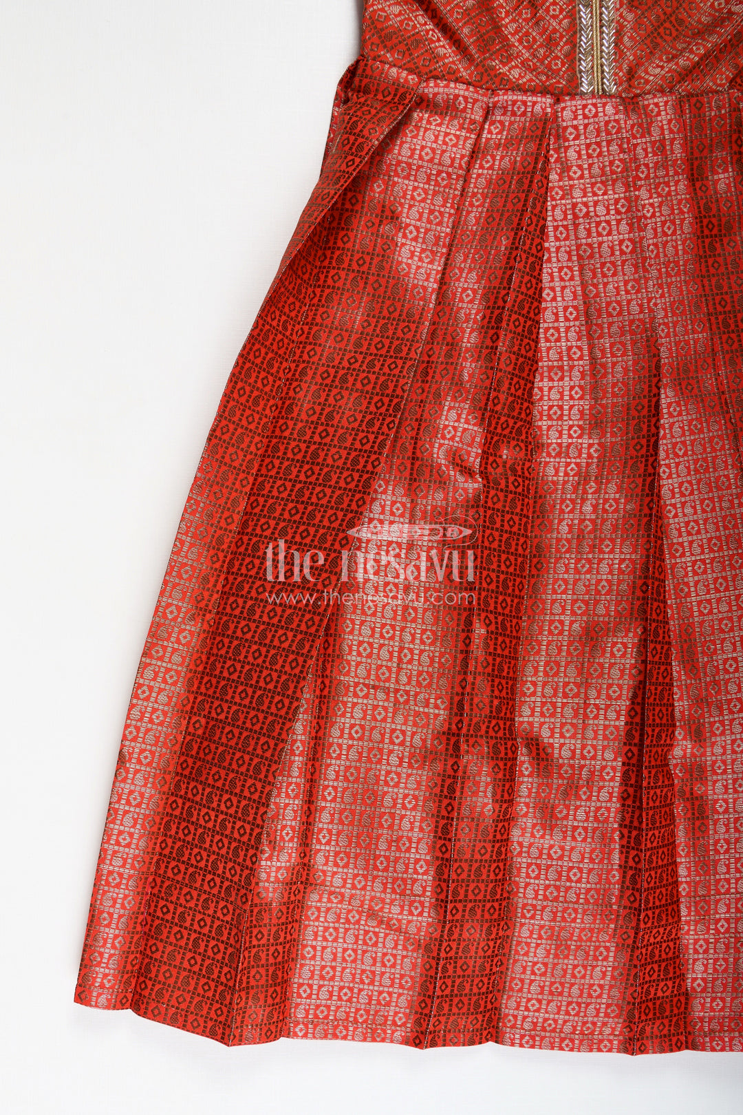 The Nesavu Girls Silk Gown Girls Anarkali Dress Design in Semi Banaras Silk with Rust Orange Zari Brocade and Flared Box Pleats Nesavu Nesavu Girls Anarkali Dress Design Rust Orange Semi Banaras Silk Golden Zari Pleated Skirt