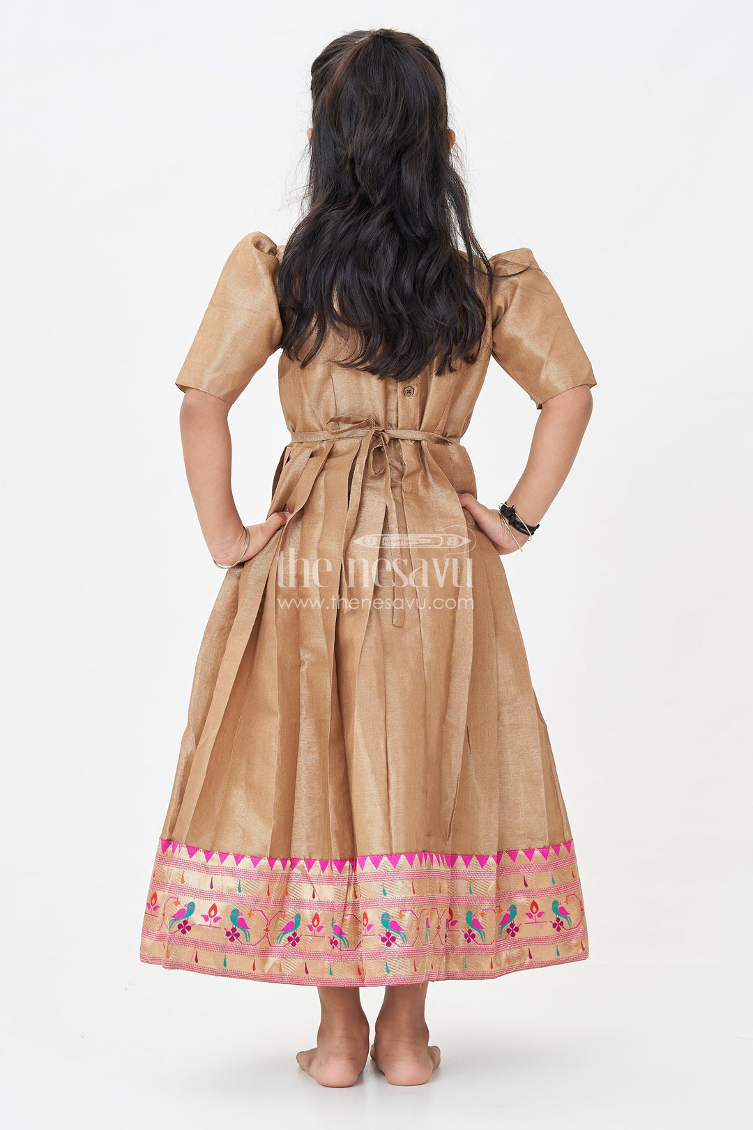 The Nesavu Girls Silk Gown Girls Anarkali Style Gown in Brown Tissue with Paithani Border and Structured Pleats Nesavu Girls Anarkali Style Gown Brown Tissue Silk Paithani Border Puff Sleeves | The Nesavu