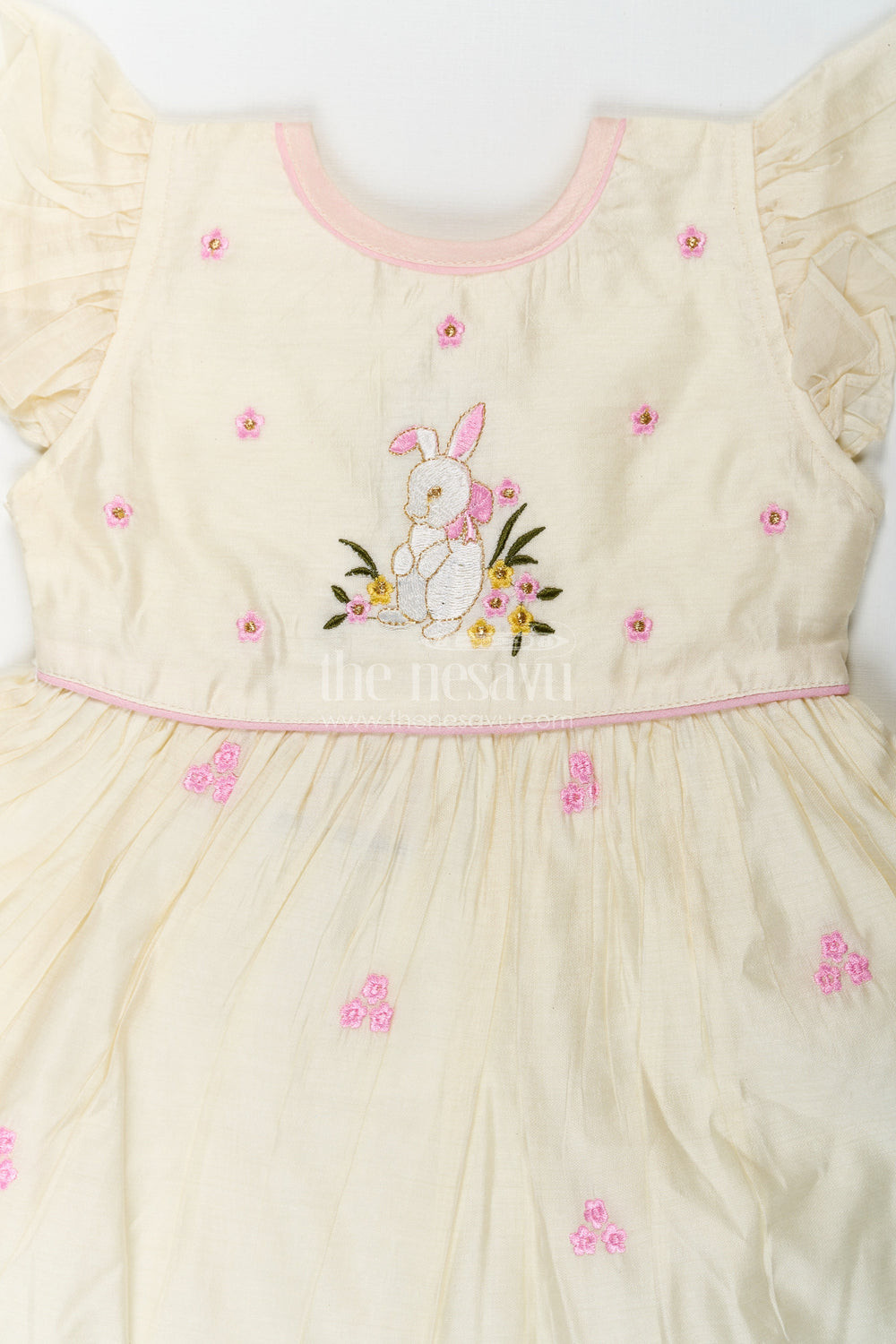 The Nesavu Girls Chanderi Frock Girls Animal Print Ruffle Dress in Chanderi with Thread Embroidery and Pink Floral Accents Nesavu Nesavu Girls Animal Print Ruffle Dress Chanderi Bunny Motif Floral Embroidery
