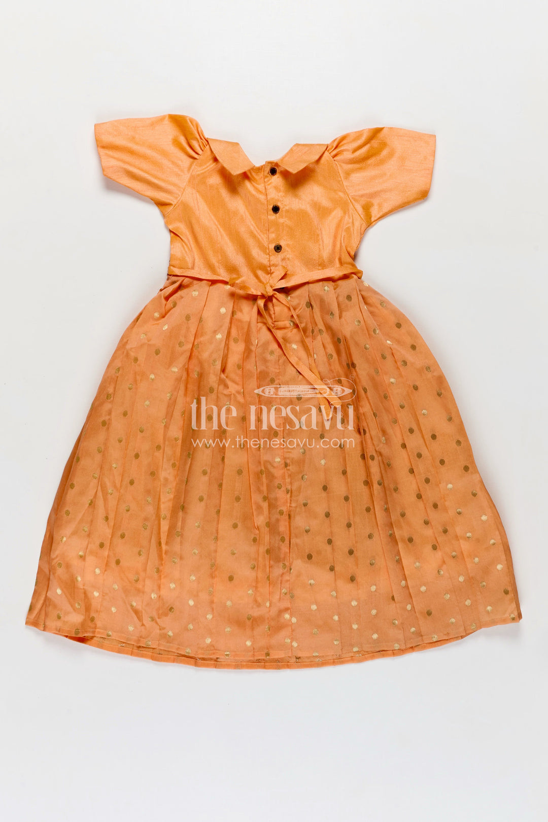 The Nesavu Girls Silk Gown Girls Birthday Gowns in Peach Raw Silk with Semi Banarasi Bottom and Peter Pan Collar Nesavu Nesavu Girls Peach Raw Silk Birthday Gowns Semi Banarasi Gold Motif Bottom