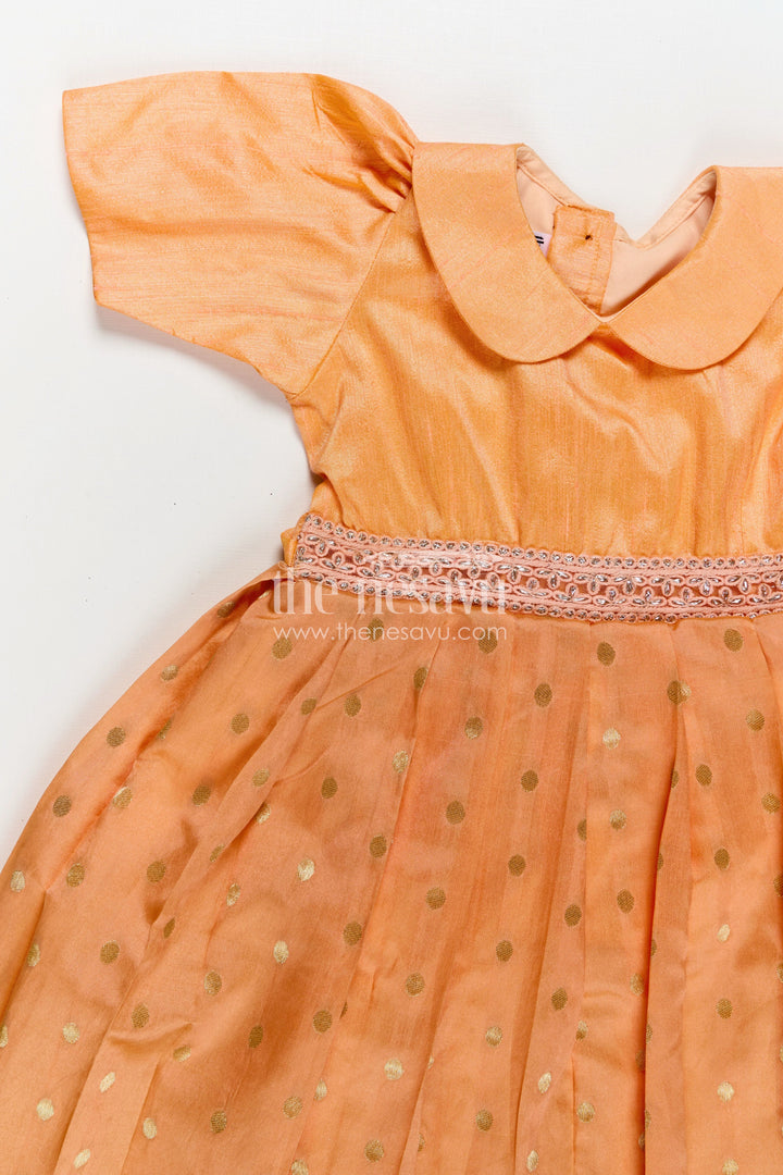 The Nesavu Girls Silk Gown Girls Birthday Gowns in Peach Raw Silk with Semi Banarasi Bottom and Peter Pan Collar Nesavu Nesavu Girls Peach Raw Silk Birthday Gowns Semi Banarasi Gold Motif Bottom