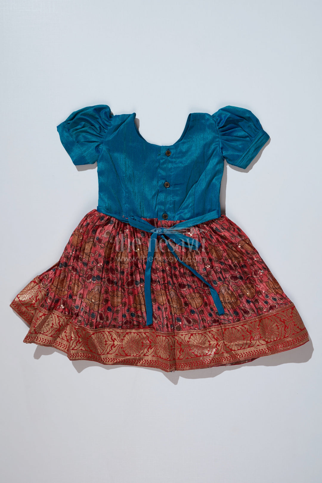 The Nesavu Silk Frock Girls Blue Ethnic Dress with Puff Sleeves and Chinon Silk Pleated Skirt for Festive Wear Nesavu Nesavu Girls Blue Ethnic Dress Puff Sleeves Chinon Silk Pleated Skirt
