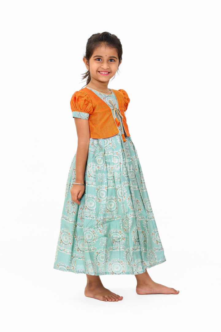 The Nesavu Girls Silk Gown Girls Blue Wedding Anarkali Dress with Traditional Prints and Contrast Orange Short Jacket Nesavu Nesavu Girls Blue Wedding Anarkali Dress Traditional Prints Contrast Orange Short Jacket