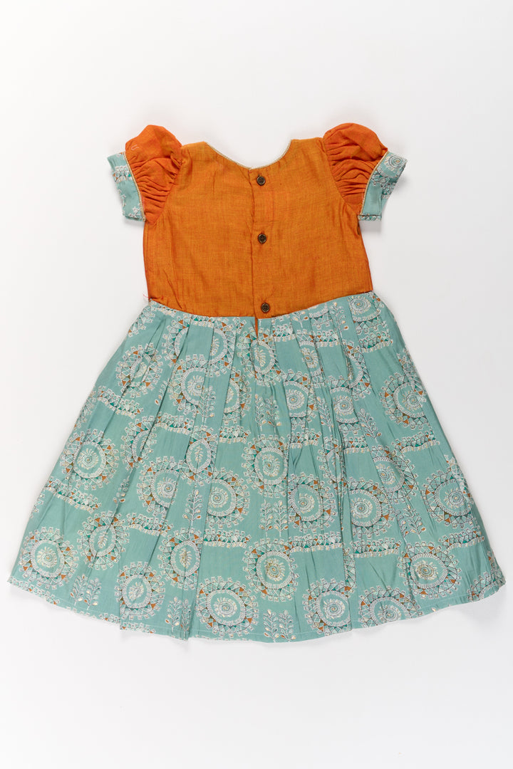 The Nesavu Girls Silk Gown Girls Blue Wedding Anarkali Dress with Traditional Prints and Contrast Orange Short Jacket Nesavu Nesavu Girls Blue Wedding Anarkali Dress Traditional Prints Contrast Orange Short Jacket