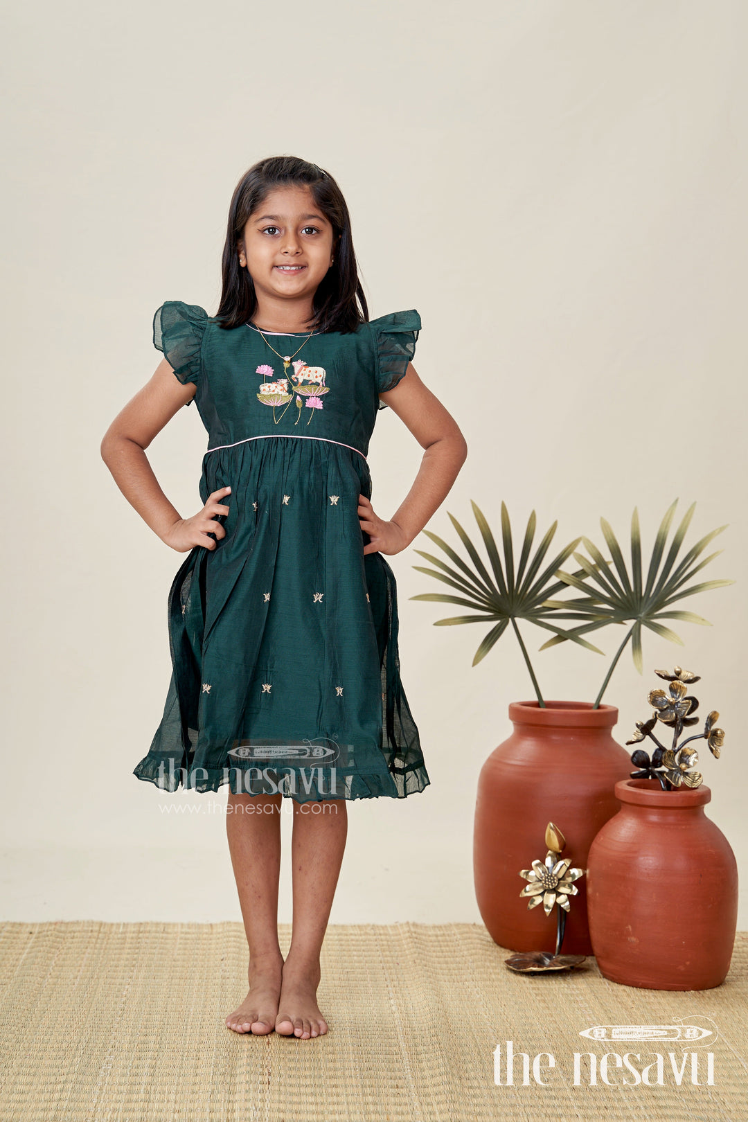 The Nesavu Girls Chanderi Frock Girls Chanderi Cotton Frock Style with Elephant Lotus Embroidery and Pleated Skirt in Forest Green Nesavu Nesavu Girls Chanderi Cotton Frock Style Elephant Lotus Embroidery Frill Detailing