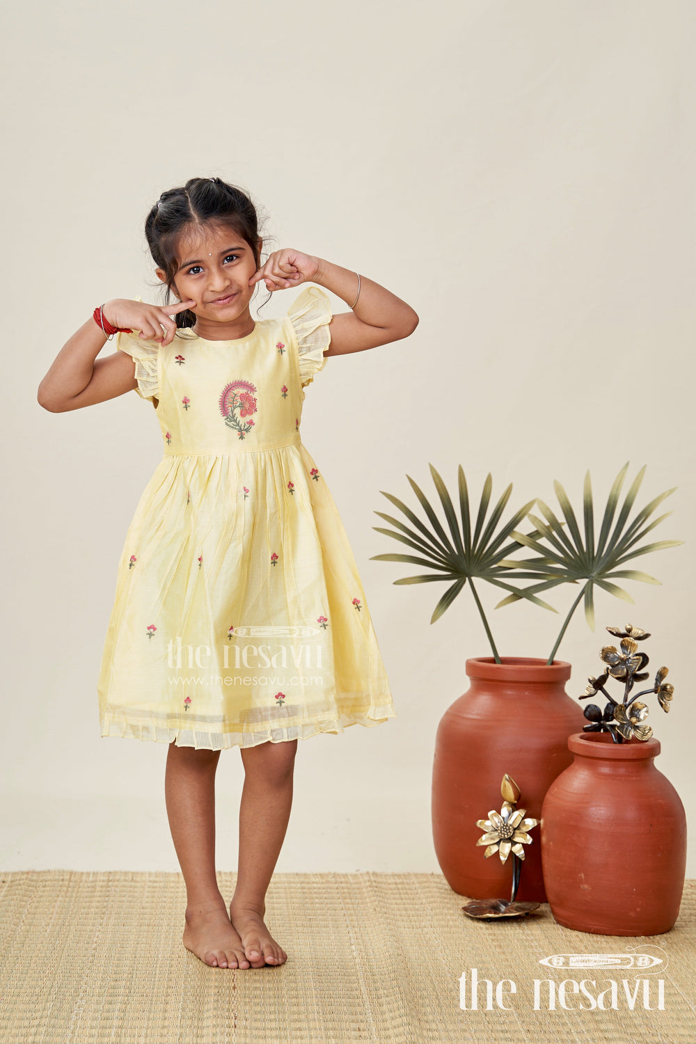 The Nesavu Girls Chanderi Frock Girls Chanderi Frock in Vibrant Colors with Thread Embroidery for Festive Moments Nesavu 16 (1Y) / Yellow GFC1839A-16 Nesavu Yellow Chanderi Cotton Girls Frock Floral Embroidery Ruffled Sleeves Traditional Wear