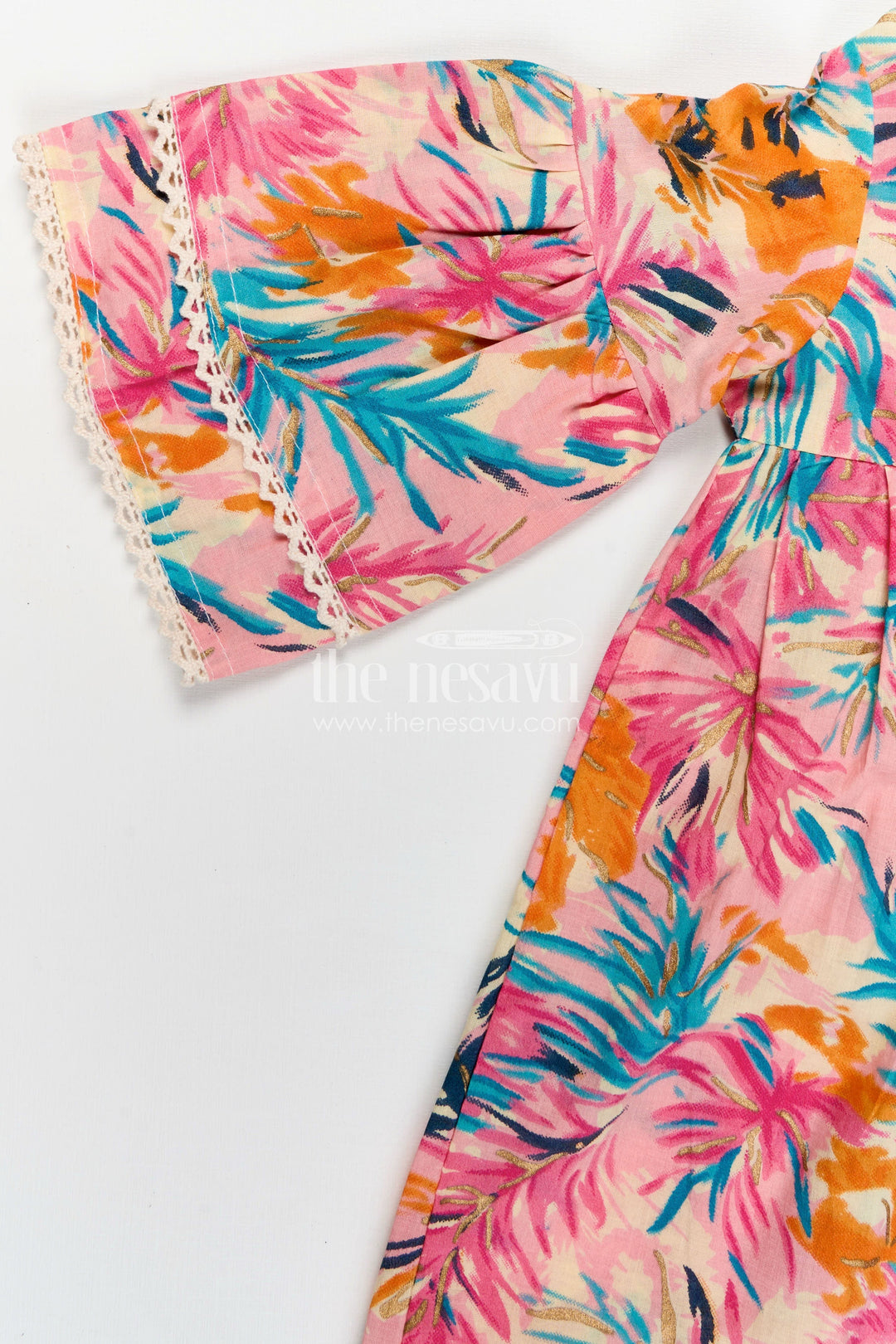 The Nesavu Girls Cotton Frock Girls Cotton Frock Girl with Flared Bell Sleeves and Vibrant Leaf Print in Multicolor Design Nesavu Nesavu Cotton Frock Girl Flared Sleeves Multicolor Leaf Print Casual Everyday Style