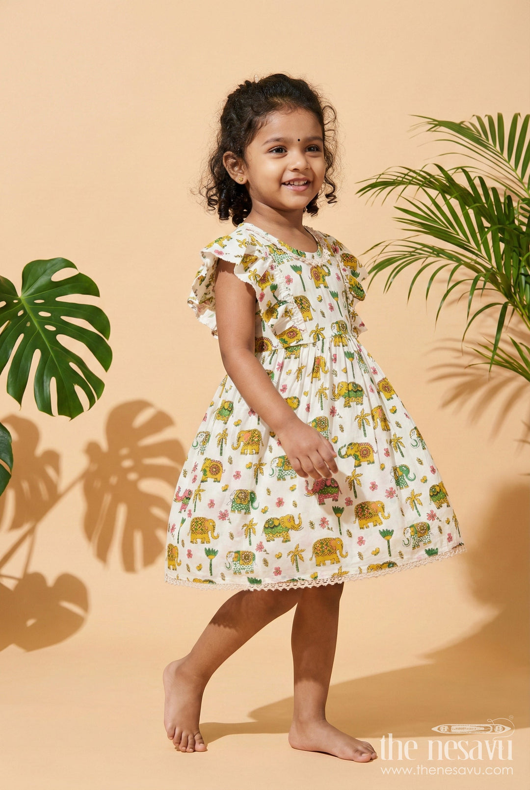 The Nesavu Girls Cotton Frock Girls Cotton Frock with Elephant Print for Zoo Visits and Playful Days Nesavu 16 (1Y) / Multicolor GFC2053A-16 Nesavu cotton frock for girls with multicolor elephant print and flutter sleeves – ideal for playful days