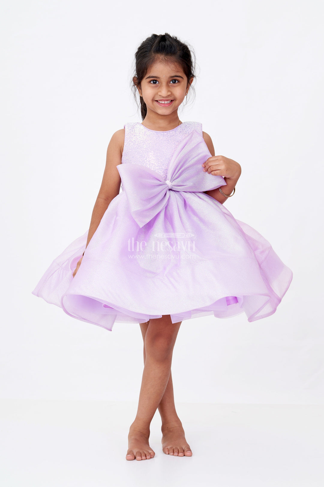 The Nesavu Girls Fancy Party Frock Girls Cotton Party Wear Frock in Lavender Organza with Giant Bow and Glittery Flared Silhouette Nesavu 16 (1Y) / Purple PF201C-16 Nesavu Girls Cotton Party Wear Frock Lavender Organza Glitter Finish Oversized Bow